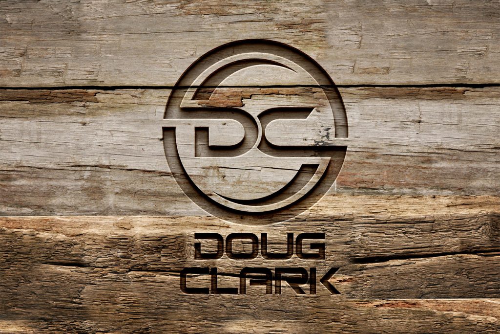 DC Logo Engraved on Wood Final Photoshop result showing Doug Clark logo engraved into wood background