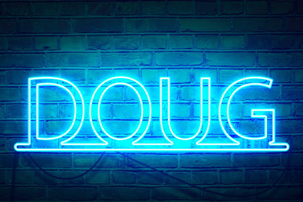 Neon Sign Text Effect – Final Composite Final neon sign Photoshop composition showing glowing text over brick wall with cords